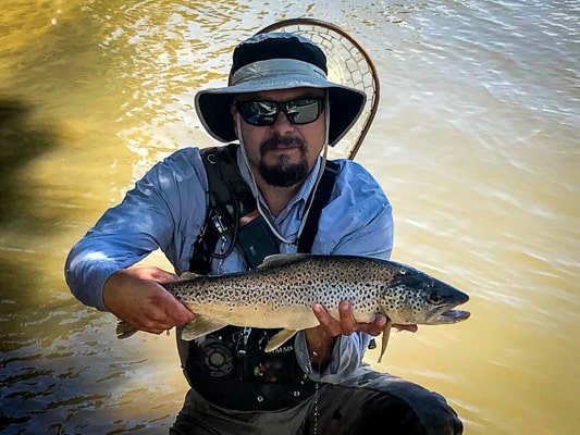 Fisherman Holding Trout