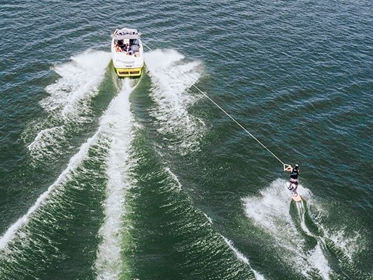 Boat pulling water skiier